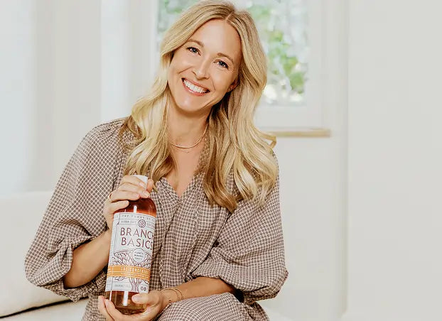 Allison posed with a bottle of Branch Basics Concentrate