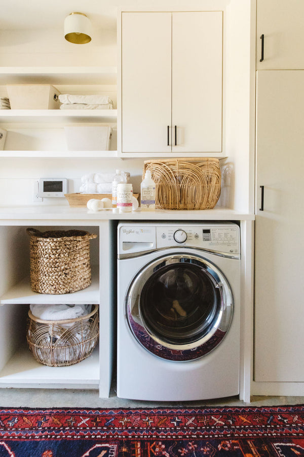 Laundry room washer using Branch Basics laundry products