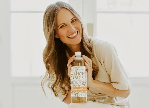 Kelly posed with a bottle of Branch Basics Concentrate