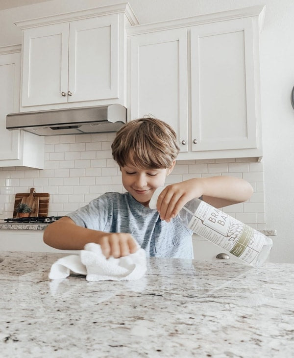 Boy cleaning with All-Purpose Spray